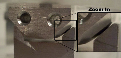 Photo showing canoe ball contact with groove.